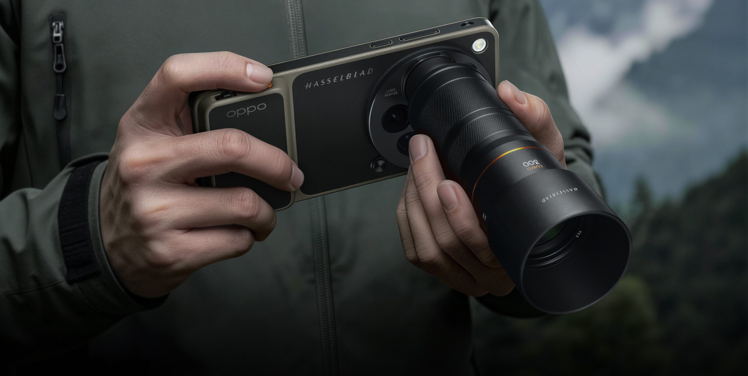OPPO Find X9 Ultra with Hasselblad LUMO 300 external lens adapter attached, held outdoors